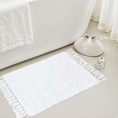 PRICES MAY VARY. Super Soft: This white shaggy bathroom rug is made of high-quality microfiber,each fiber measuring 1.5cm/0.5in in height. The high-density plush provides a luxurious and soft touch, bringing warmth and comfort to your feet. This soft bathroom rug is perfect for families, kids, and pets, making it an essential and stylish addition to any bathroom. Super Absorbent: Upon stepping out of the bathtub, this high-quality microfiber rug quickly absorbs water droplets from your body, pre Modern Bathroom Decor, Cute Bathroom Rugs, Bathroom Mat, Fluffy Bathroom Rugs, Dream Bathroom, White Bathroom Rug, Soft Bathroom, Bathroom Carpet, Stylish Rugs