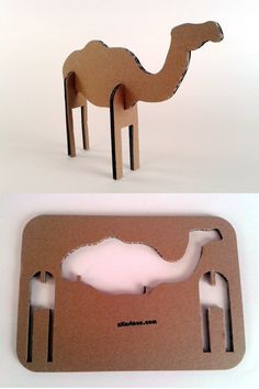 a cardboard cut out of a camel with its head in the shape of a hole