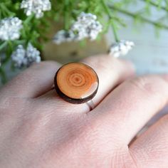 This natural ring is made from a fallen tree branch, which I cut into slices and sanded. This wooden gem has a natural pattern with discolorations. The top is covered with resin. The ring is made from sterling silver and it's adjustable size. Minimal ring diameter is 17 mm (0,7 in). 2 similar rings available. Wearing this ring you can always have a piece of nature with you :) Wood dimensions: ~ 18 mm (0,7 in) diameter You will receive this unique ring in a nice jewelry box. I will pack it into b Minimalist Brown Rings For Gifts, Woodland Earrings, Ocean Earrings, Fallen Tree, Woodland Jewelry, Nice Jewelry, Minimal Ring, Nature Ring, Wooden Ring