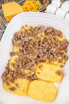 sausage hash browns with brown patty breakfast casserole in a white dish on a table