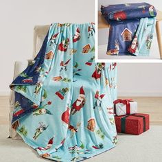 there is a blue blanket with santa claus on it and presents under the covers in front