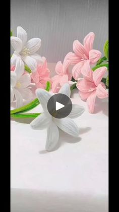 a cake decorated with pink and white flowers