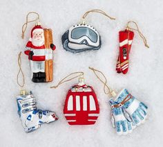 christmas ornaments are arranged in the shape of snow skiers, santa clause and ski equipment