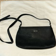 Black Calvin Klein Pocketbook. Adjustable Strap. Can Be Worn As A Cross Body Or Shortened To Over The Shoulder. Pockets On Front And Back. Zipper Top With Zipper Inside. Never Worn. Calvin Klein Black Shoulder Bag With Removable Pouch, Calvin Klein Black Crossbody Bag, Calvin Klein Black Bag For Everyday Use, Calvin Klein Black Shoulder Bag For Daily Use, Calvin Klein Black Shoulder Bag For Everyday, Black Calvin Klein Shoulder Bag For Everyday, Everyday Calvin Klein Black Shoulder Bag, Calvin Klein Black Everyday Shoulder Bag, Everyday Calvin Klein Black Bag