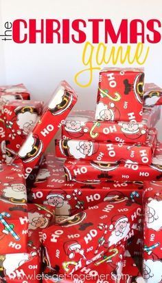 a pile of red wrapped presents sitting on top of each other