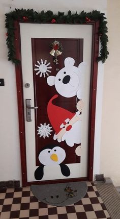 a door decorated with an image of a polar bear and penguin