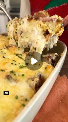 a person scooping food out of a casserole dish