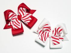 "🍭Christmas Candy Cane Hair Bows🍭 Red & White Stripes These Holiday Bows are made with Red & White Striped Bow in the center and your choice of what color for the larger bow. Red or White 5\" Bows made with Grosgrain Ribbon Candy Cane Bows https://www.etsy.com/listing/871303042/christmas-hair-bow-holiday-hairbow-candy Red Striped Bows https://www.etsy.com/listing/885297513/christmas-hair-bow-holiday-hairbow-candy Green Striped Bows https://www.etsy.com/listing/885272269/christmas-hair- Graduation Candy Bouquet, Candy Cane Hair, Kindergarten Graduation Gift, Holiday Hair Bows, Diy Graduation Gifts, Candy Hair, Ribbon Candy, Candy Red