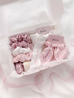 a box filled with lots of pink and white items