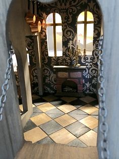 the inside of a doll house with an open door