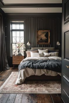 a bedroom with black walls and wooden floors