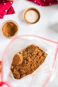 the ingredients to make homemade pumpkin spice are in small bowls on top of a white tablecloth