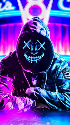 a person wearing a black mask with neon lights in the background and an image of a skull on their face