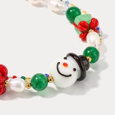 Introducing the Selenichast Snowman Party Bracelet, crafted from glossy brushed aluminum and featuring a captivating snowman charm. A perfect accessory for a night out, it will add a touch of class and elegance to add an alluring, festive feel to any outfit. DETAILS Materials: Glass, Millefiori Glass Beads Measurements: 1 6-22cm Weight: 15g Whimsical White Beaded Bracelets As A Gift, Whimsical White Beaded Bracelets As Gift, Whimsical White Beaded Bracelet As Gift, White Whimsical Beaded Bracelet As Gift, Holiday Festive Jewelry Bracelet, Multicolor Beaded Bracelets For Christmas Holiday, Handmade White Charm Bracelet For Party, Whimsical White Bracelet As Gift, Whimsical White Bracelet For Gift