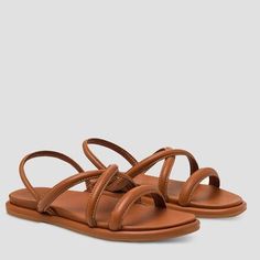 Whether you are on an island or just island time, the OluKai Tiare Strappy Sandal is a great friend. This strappy 100% leather slide is designed to be worn casually or dressed up so that your feet can feel good for tomorrows adventure. Leather Slip-on Sandals For Beach Season, Strappy Sandals For Beach Season Vacation, Leather Open Toe Slingback Sandals For Beach Season, Summer Strappy Slingback Sandals For Vacation, Strappy Slingback Sandals For Summer Vacation, Adjustable Strappy Sandals For Vacation, Leather Sandals With Single Toe Strap For Beach Season, Leather Lined Open Toe Flip Flops For Vacation, Brown Slip-on Slingback Sandals For Beach