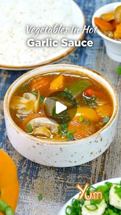 vegetable la hot garlic sauce in a white bowl on a table with other vegetables and rice