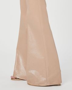 This 90s-inspired sleek wide leg is designed with a high-rise and a flattering bow leg silhouette. It has a glittery, leather-like look, but doesn’t sacrifice comfort. Cut from our coated TRANSCEND denim in a beige and silver glitter ombre luxe coating, this style is luxuriously soft with plenty of stretch and recovery to give it a fit that shines all day and night. | Leenah Wide Leg Jean - Latte/Silver Glitter Ombre Luxe Coating Coat | Size 26 Elegant Sparkling Bottoms For Evening, Elegant Shiny Bottoms For Evening, Elegant Flare Wide Leg Pants For Party, Elegant Flared Wide Leg Party Pants, Elegant Glitter Bottoms For Evening, Elegant Wide Leg Glitter Bottoms, Elegant Wide Leg Glitter Pants, Chic Shiny Bottoms For Evening, Glamorous Wide Leg Pants For Evening