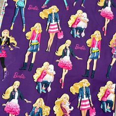 barbie dolls on purple background with name tags