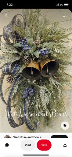 a christmas wreath with bells and greenery