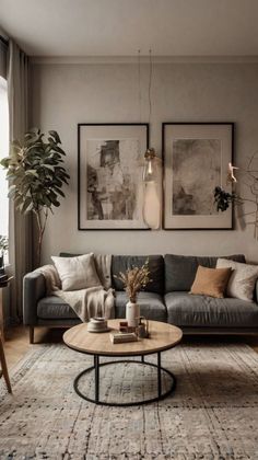 a living room filled with furniture and pictures on the wall above it's coffee table