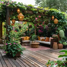 an outdoor living area with lots of plants