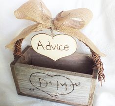 a wooden box with a sign that says advice and a heart on it sitting in front of a white background