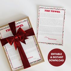 an open gift box with a red bow on it and the text'the towel '