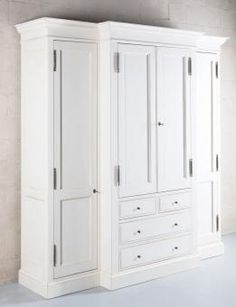 a white armoire with two doors and drawers