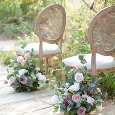 the chairs are decorated with flowers and greenery