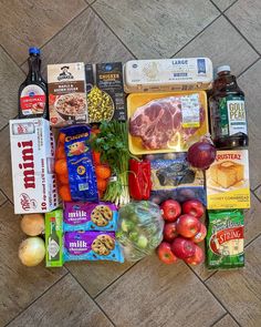 an assortment of food is laid out on the floor