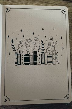 a notebook with some plants and flowers on it