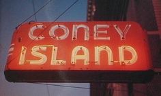 a neon sign that says coney island on it