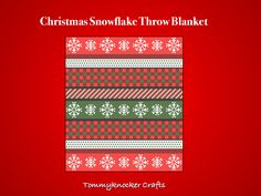 a christmas snowflake throw blanket on a red background