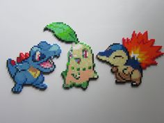 three pixellated images of different pokemon characters on a white surface, each with an individual's face