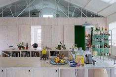 a kitchen with lots of counter space and various items on the counter top in front of it