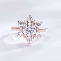 a white diamond ring with rose gold accents