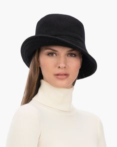 A cozy, lightweight women's bucket hat of spun wool with trapunto stitched brim rolls up easily into a coat pocket or a tote bag. Eric says, "It's definitely a bucket hat season where the attitude is a bit more casual than a fedora." What makes this women's bucket hat most desirable is that the crown is spun and then blocked to achieve the shape; The crown has no visible seams so it doesn't feel thick, while providing great insulation and protection from the elements. Brim span: 2.75"(7cm) Fully Winter Travel Hats With Curved Brim, Classic Felt Bucket Hat For Winter, Classic Winter Felt Bucket Hat, Winter Felt Bucket Hat, Casual Wool Bucket Hat With Curved Brim, Wool Winter Bucket Hat, Winter Cloche Hat With Short Brim, Winter Travel Hats In Solid Color, Classic Winter Bucket Hat