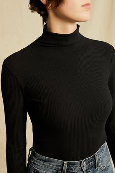 Long sleeve turtleneck with a fitted silhouette, made in our signature ultra-soft Paris Rib. This versatile top is perfect to tuck into jeans or wear as a first layer. Model is 5'10" and wears size Small.