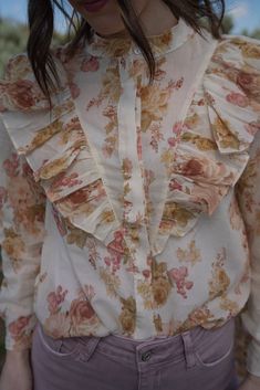 We are really stepping up our blouse game this spring! Florals are forever our favorite pattern. Victorian style top Front button down closure Ruffle detail 100% polyester Long sleeve that comes shorter than the wrist Models are 5'4" and wearing a size small. The length of a size small is 19.5". Small: 2-4 Medium: 6-8 Large: 10-12 Spring Florals, Top Sales, Victorian Style, Victorian Fashion, Step Up, Pretty Dresses, Shirts Tops, Top Styles, Kids Fashion