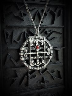 This Sigil of Amon necklace is an handmade pewter sculpture with a gem of your choice (my favorite is the red abalone, if you are looking for a very nice bloody red) This seal of Amon is one of the 72 Sigils of Goetia from Ars Goetia's Demonology This Sigil of Goetia pendant is sold with a free 18'' stainless steel chain, if you would like to have a different length for the chain, you can write the desired length in the private note section when ordering :) This Seal of Amon is a pendant of 3cm Red Spiritual Metal Jewelry, Symbolic Antique Finish Necklace As Collectible, Spiritual Red Metal Necklace, Symbolic Antique Finish Necklaces For Collectors, Nickel Free Gothic Necklaces For Collectors, Nickel-free Gothic Necklaces For Collectors, Gothic Nickel-free Necklaces, Red Symbolic Engraved Jewelry, Symbolic Antique Silver Pewter Jewelry