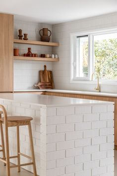 Modern coastal kitchen featuring warm timber cabinetry brushed brass tapware exposed shelves soft concrete flooring and white brick Modern Coastal Interior, Modern Coastal Interior Design, Contemporary Kitchen Remodel, Abi Interiors, Coastal Interior Design, Coastal Interior, Kitchen Remodel Design, Coastal Interiors