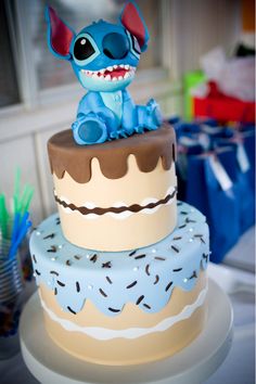 there is a cake that has been decorated with an image of stitch