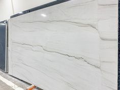 a large white marble counter top in a room