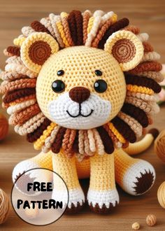 a crocheted lion sitting on top of a wooden table with nuts around it