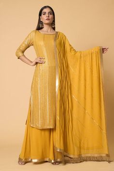 Kadambari yellow straight kurta with striped pattern metallic sequin embroidery. Comes with embroidered hem farshi palazzo and sequin striped dupatta. - Aza Fashions Yellow Sharara With Gold Embroidery, Elegant Yellow Festive Palazzo Set, Yellow Fitted Elegant Sharara, Elegant Festive Yellow Palazzo Set, Elegant Yellow Sets With Gold Embroidery, Semi-stitched Yellow Georgette Palazzo Set, Gold Semi-stitched Palazzo Set, Festive Yellow Sharara With Gold Embroidery, Gold Georgette Palazzo Set In Traditional Drape