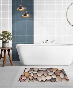 a white bath tub sitting on top of a bathroom floor next to a wooden stool