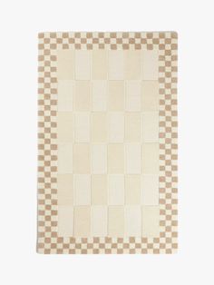 a beige and white checkered rug with squares on the bottom, one square in the middle