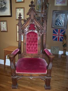 a red chair sitting on top of a hard wood floor