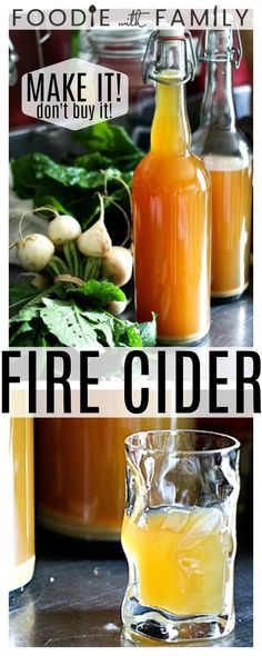 two bottles of fire cider sitting on top of a table next to some vegetables