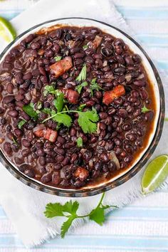 a bowl filled with black beans and garnished with cilantro